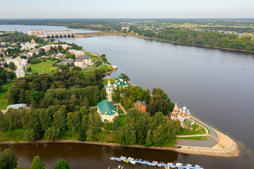 Scenic aerial view of Uglich townscape on banks of Volga river overlooking Kremlin Cathedrals on cloudy summer day, Yaroslavl region, Russia