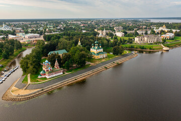 Drone view of the Volga River and temples, as well as residential areas in the city of Uglich in the summer afternoon, Russia