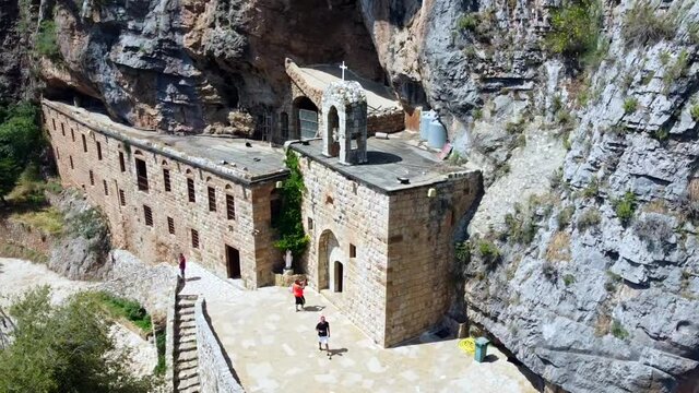 Tourists Visit The Historic Mar Lichaa Monastery In Kadisha Valley, Bsharre, Lebanon. - aerial