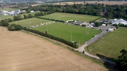 Aerial View Over Rugby Training Pitches In Canterbury. Slow Dolly Forward
