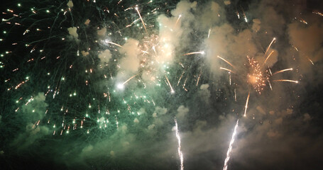 Green Firework celebrate anniversary happy new year 2022, 4th of july holiday festival. Green firework in night time celebrate national holiday. Countdown to new year 2022 festival party time event