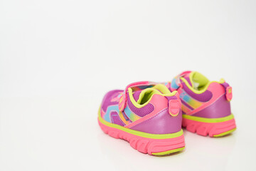 color kid  sneakers shoes on floor rear view soft focus