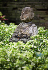 Old little sand statue, closeup. In a quiet and comfortable natural environment