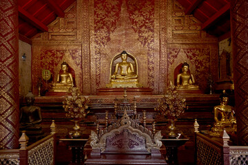 Fototapeta premium Golden Buddha statues, inside the temple. Chiang Mai, Thailand