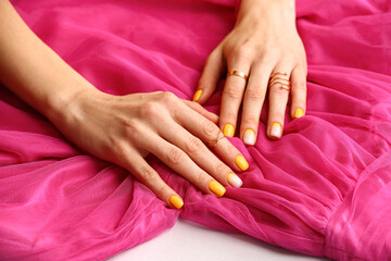 Fototapeta premium Female hands with beautiful manicure and dress, closeup