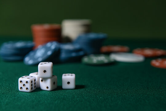Dices for poker on dark background