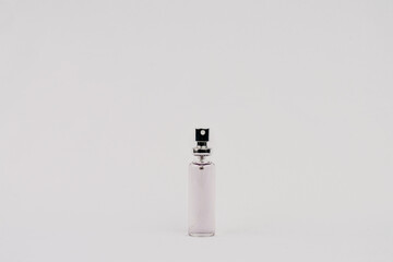 transparent bottle with purple liquid spray tip