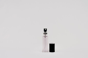 transparent bottle with purple liquid spray tip
