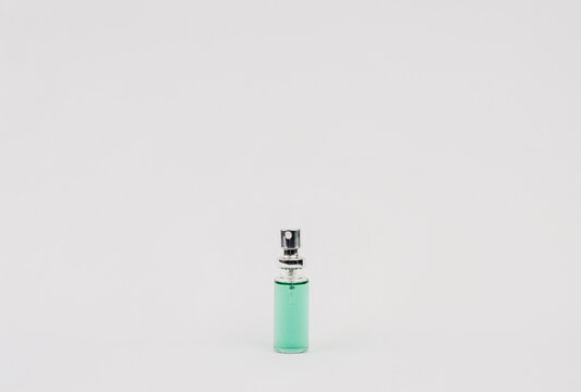 transparent bottle with blue liquid spray tip
