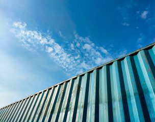 Fototapeta na wymiar Low angle view of container on the train against clear blue sky