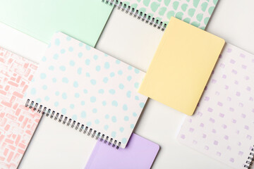 Stylish notebooks on white background, closeup - obrazy, fototapety, plakaty