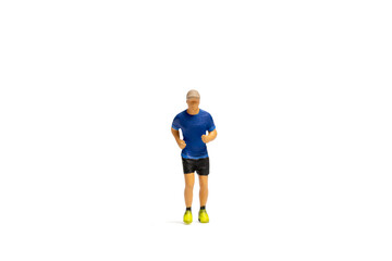 Fototapeta na wymiar Miniature people, Man in fitness wear running on white background and space for text