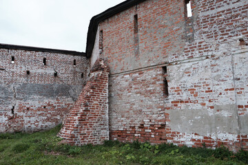 Old monastery red brick wall, destruction
