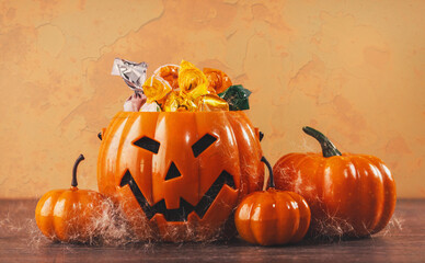 Orange Halloween pumpkins with golden spider webs and branches. happy halloween party decoration....