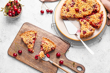 Composition with tasty cherry pie on light background