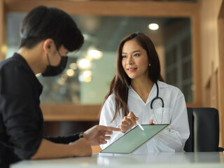 Doctor or practitioner check up treatment results, using digital tablet to consultation