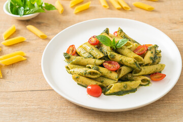 penne pasta with pesto sauce and tomatoes
