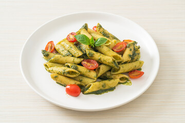 penne pasta with pesto sauce and tomatoes
