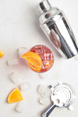 Glass of tasty Negroni cocktail on light background