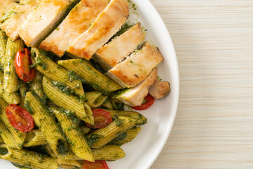 penne pasta in pesto sauce with grilled chicken