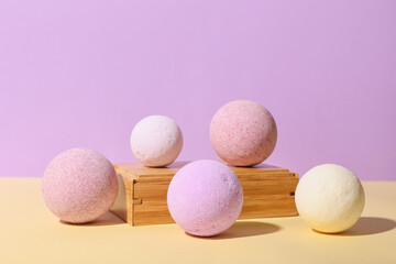 Composition with lavender bath bombs on color background