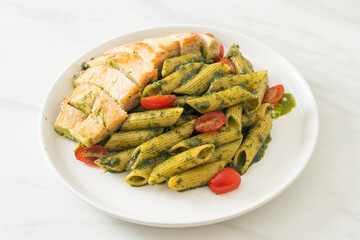 penne pasta in pesto sauce with grilled chicken