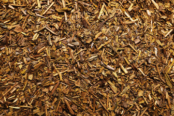 Fototapeta premium Dry hojicha green tea as background, closeup