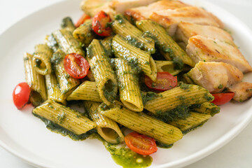 penne pasta in pesto sauce with grilled chicken