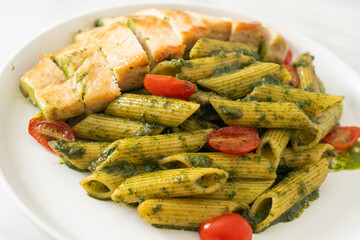 penne pasta in pesto sauce with grilled chicken