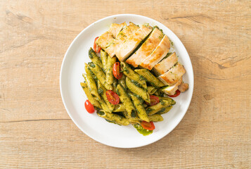 penne pasta in pesto sauce with grilled chicken
