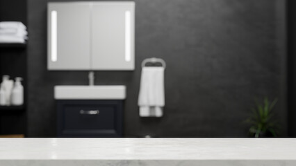 Obraz na płótnie Canvas Empty marble tabletop for montage over blurred modern dark bathroom