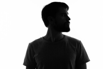 silhouette of a man in the shadows gesture with hands basing studio