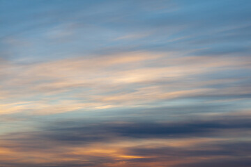 Colorful sunset or sunrise in the sky. The sky and clouds are painted in different delicate colors.