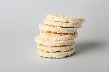 Stack of crispy rice crackers on grey background