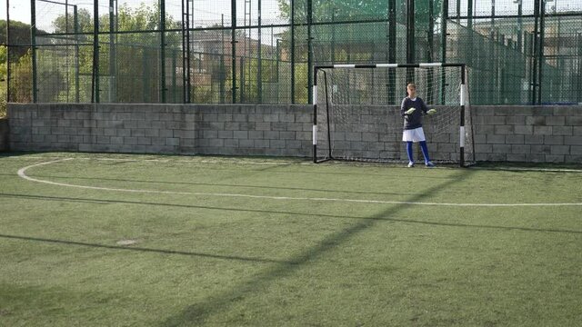 Football soccer players with ball. Footballers kicking football match on the pitch. Young teen soccer game