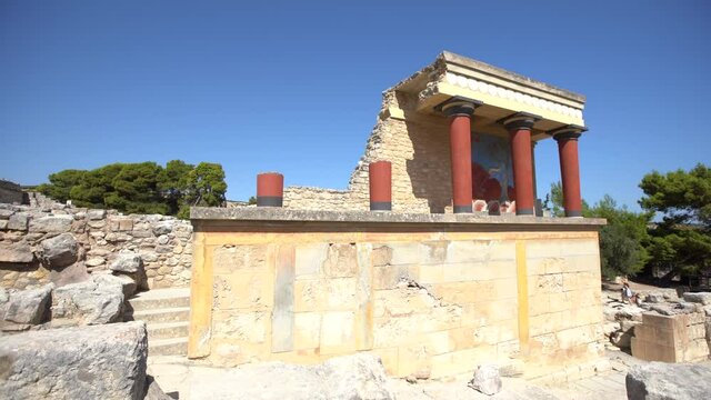 Telephoto shot of the north entrance to the Minoan Palace of Knossos in Heraklion, Crete, Greece with the charging bull fresco. Knossos is the largest Bronze Age archaeological site in Crete.
