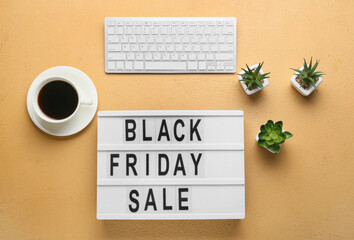 Board with text BLACK FRIDAY SALE, PC keyboard and coffee on color background