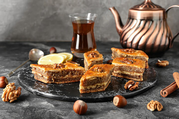 Board with tasty baklava on table