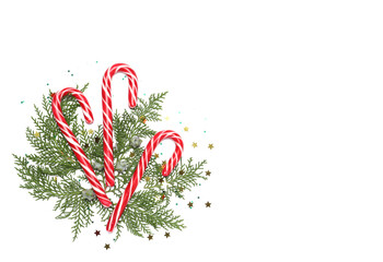 Christmas composition with candy canes on white background