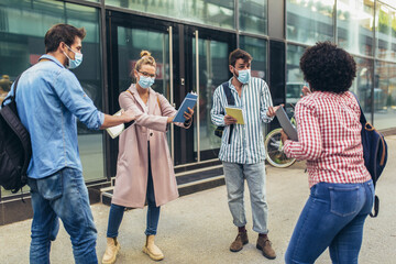 Distance learning. Social distance. New normal life. University students standing outdoor.