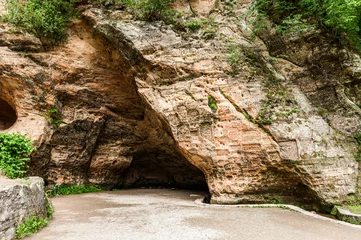 Tuinposter Gutmanis cave is an ancient landmark in Latvia © Fyle