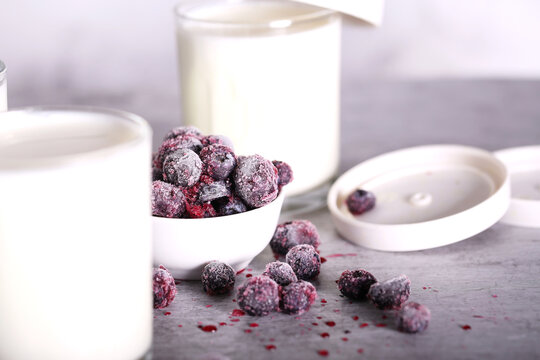 homemade yogurt with berries in glass glasses is on the table