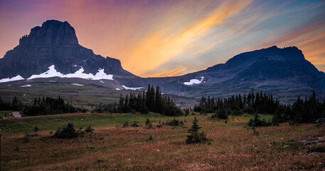 Mountain Sunset with Wildflowers at Hidden Lake Trail, Logan Pass, Glacier National Park, Montana - obrazy, fototapety, plakaty