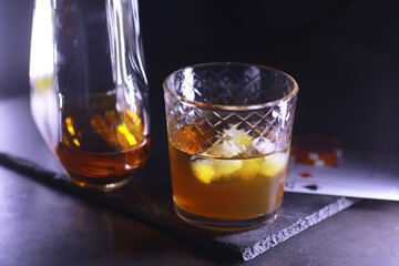 Gambling Card games for money. Texas Hold'em Poker. Cards in hand, playing chips, deck of cards of alcohol in a glass.