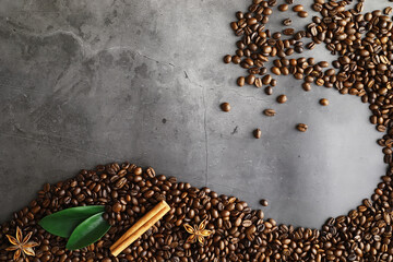 Bag of coffee. Coffee beans roasted on the table. Coffee beans with green leaves for cooking.