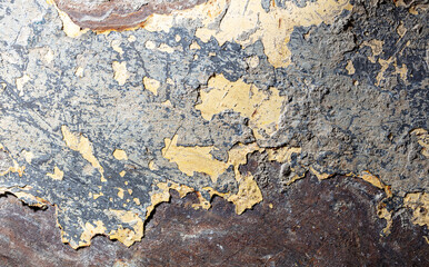 Concrete and paint on a metal surface as an abstract background.