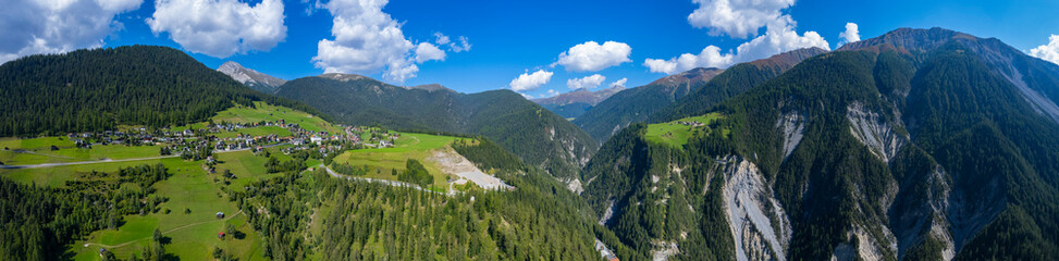 Fototapeta na wymiar Aerial view around the village Wiesen in Switzerland on a sunny day in summer.