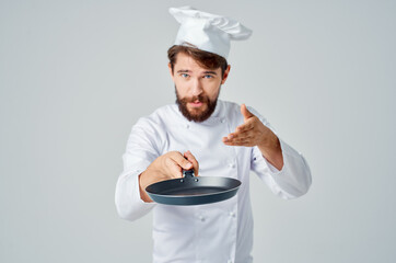 a man in a chef's uniform restaurant provision of services Professional