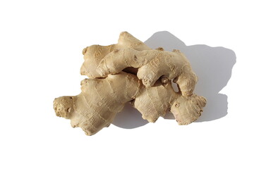 Fresh ginger root lies on a white isolated background.