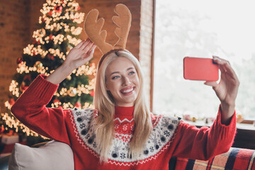 Portrait of attractive cheerful girl taking selfie wearing festal look funny accessory eve at modern loft industrial style indoors